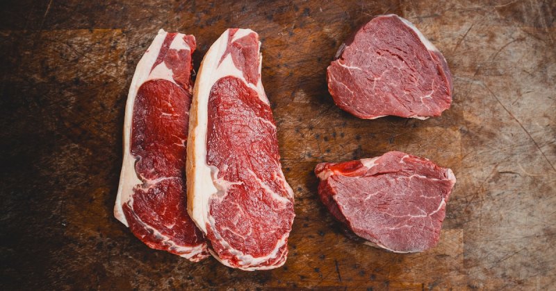 Image of steaks on a cutting board.